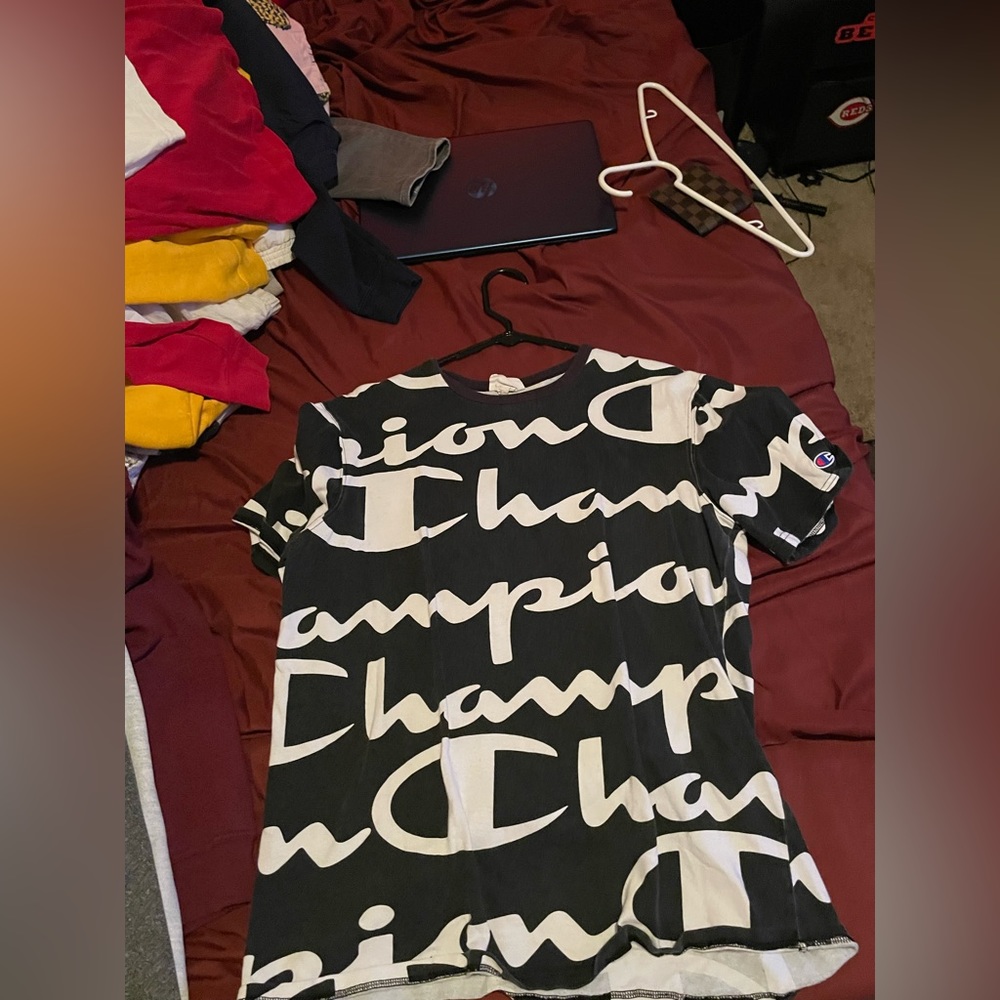 Champion shirt with the words champion all over slightly used